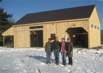 Family in front of barn